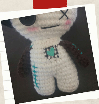 decorative patch on a mushroom crochet doll