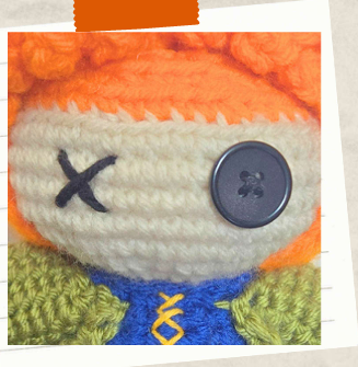 Handmade crochet witch poppet with button eye detail.