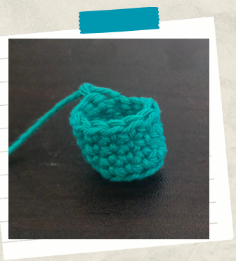 Easy amigurumi keychain pattern showing crocheted leg before assembly.