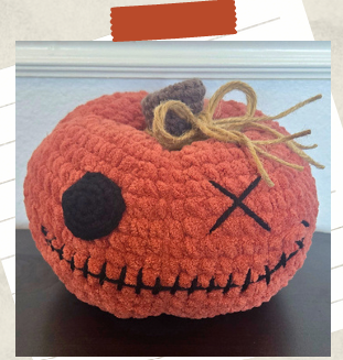 Crochet pumpkin pattern featuring a spooky plush pumpkin with button eye and stitched smile
