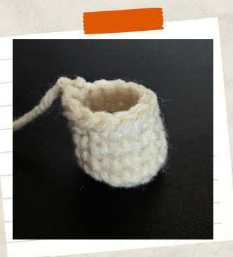 Beginner-friendly crochet witch pattern showing leg assembly.