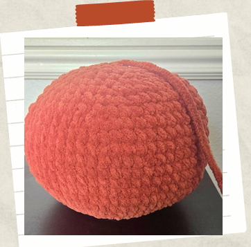 Crochet pumpkin pattern pieces before assembly for Halloween amigurumi project