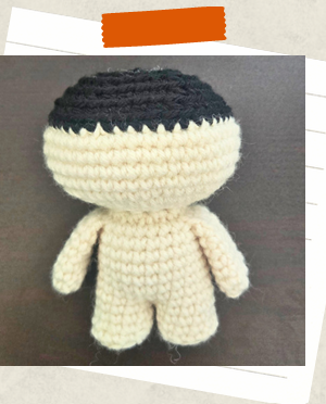 Crochet doll head in progress for free witch crochet pattern.