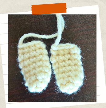Crochet witch arms before attaching to amigurumi doll body.