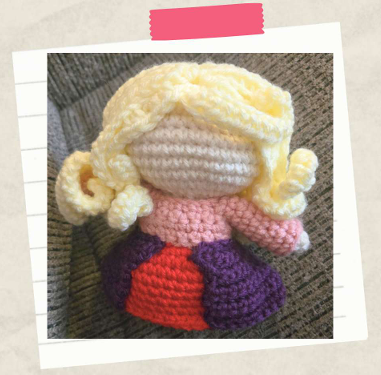 Finished long blonde hair detail on a handmade witch crochet doll