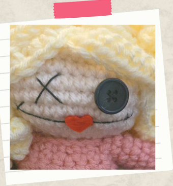 Close up of stitching details on face of Sarah Sanderson inspired amigurumi doll