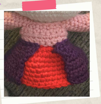 Completed crochet witch doll wearing a detailed handmade dress and Halloween-inspired outfit