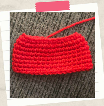 Crochet skirt piece for a witch doll made with colorful yarn for a Halloween amigurumi project