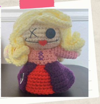 Easy Halloween crochet pattern for a witch sister inspired doll with yarn hair and stitched details