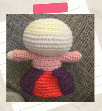 Attaching a crocheted witch dress skirt to a handmade amigurumi doll