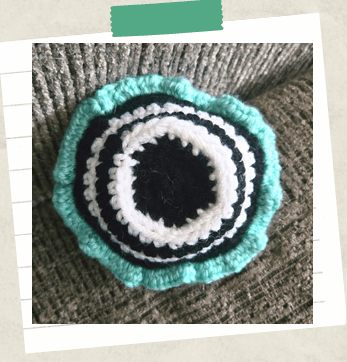 An underneath shot of a crochet cupcake to show the bottom portion