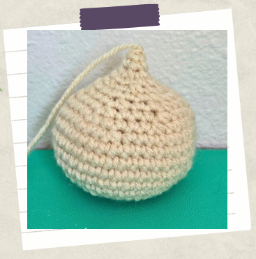 the start of a crochet garlic bulb before sculpting and shaping