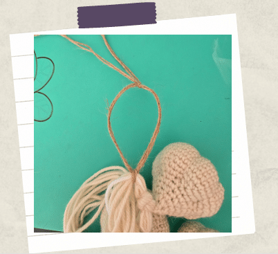 A tutorial photo showing a loop created with jute twine.
